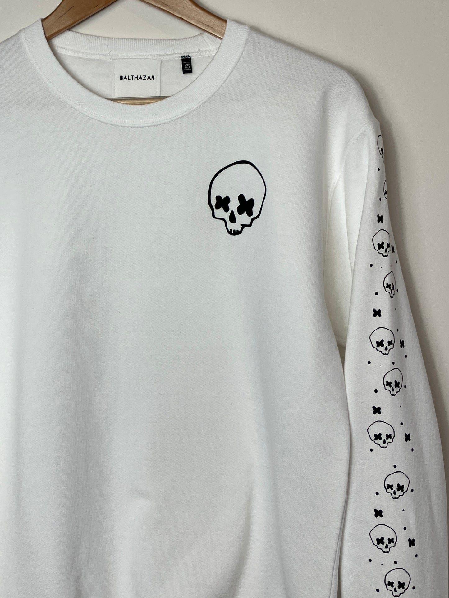 Cross eyed skull confetti sleeved sweatshirt
