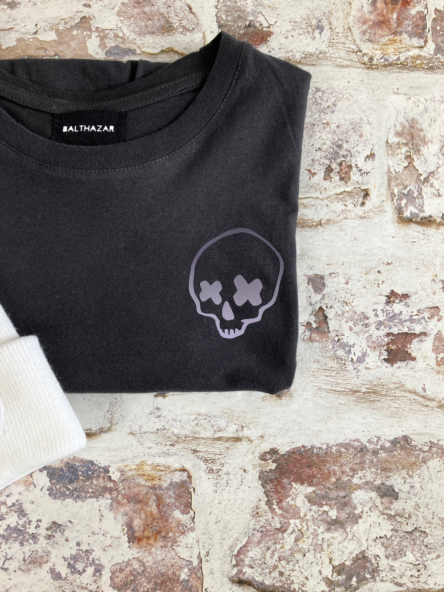 Miniature cross eyed skull t-shirt