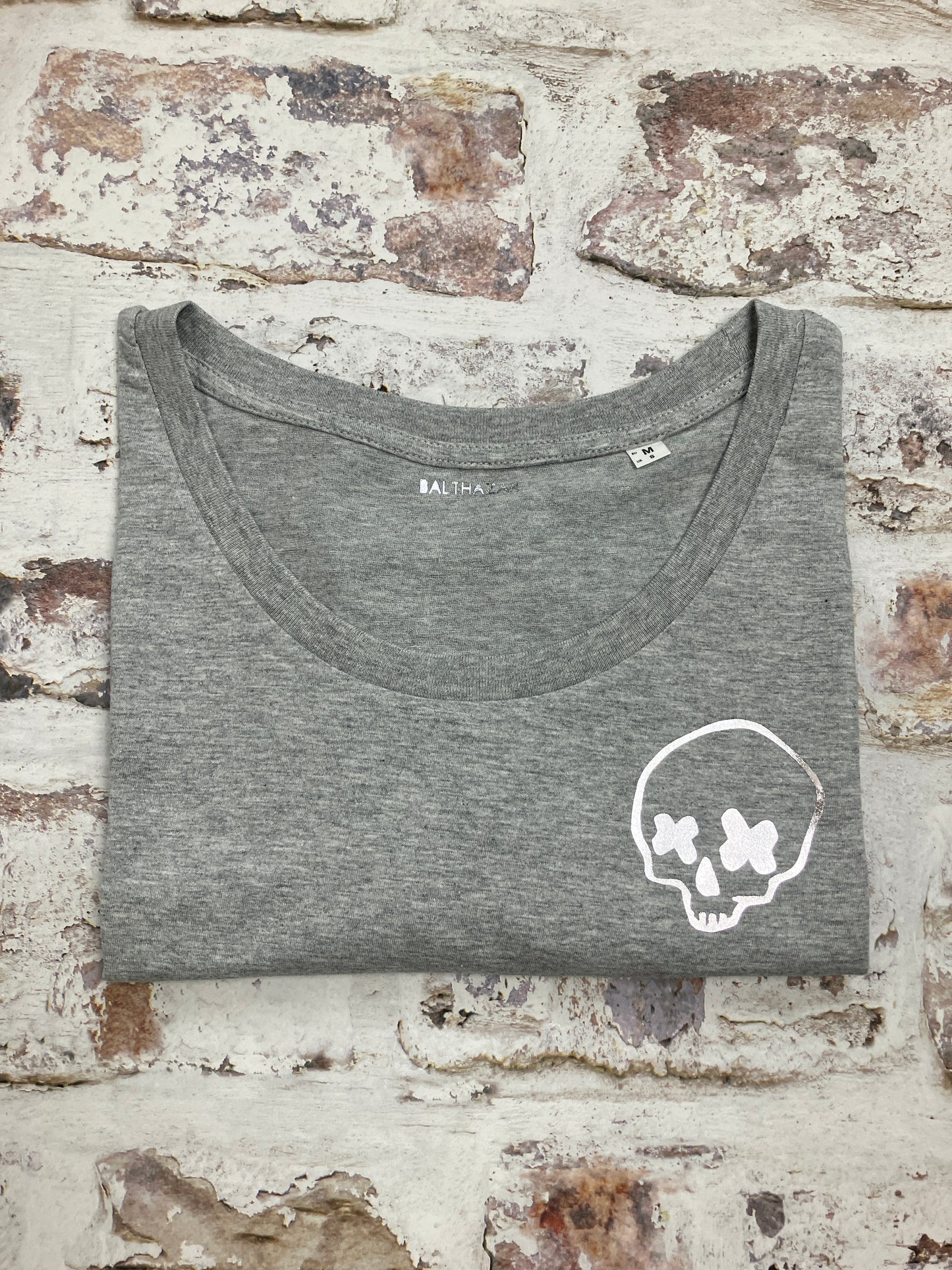 Miniature cross eyed skull t-shirt