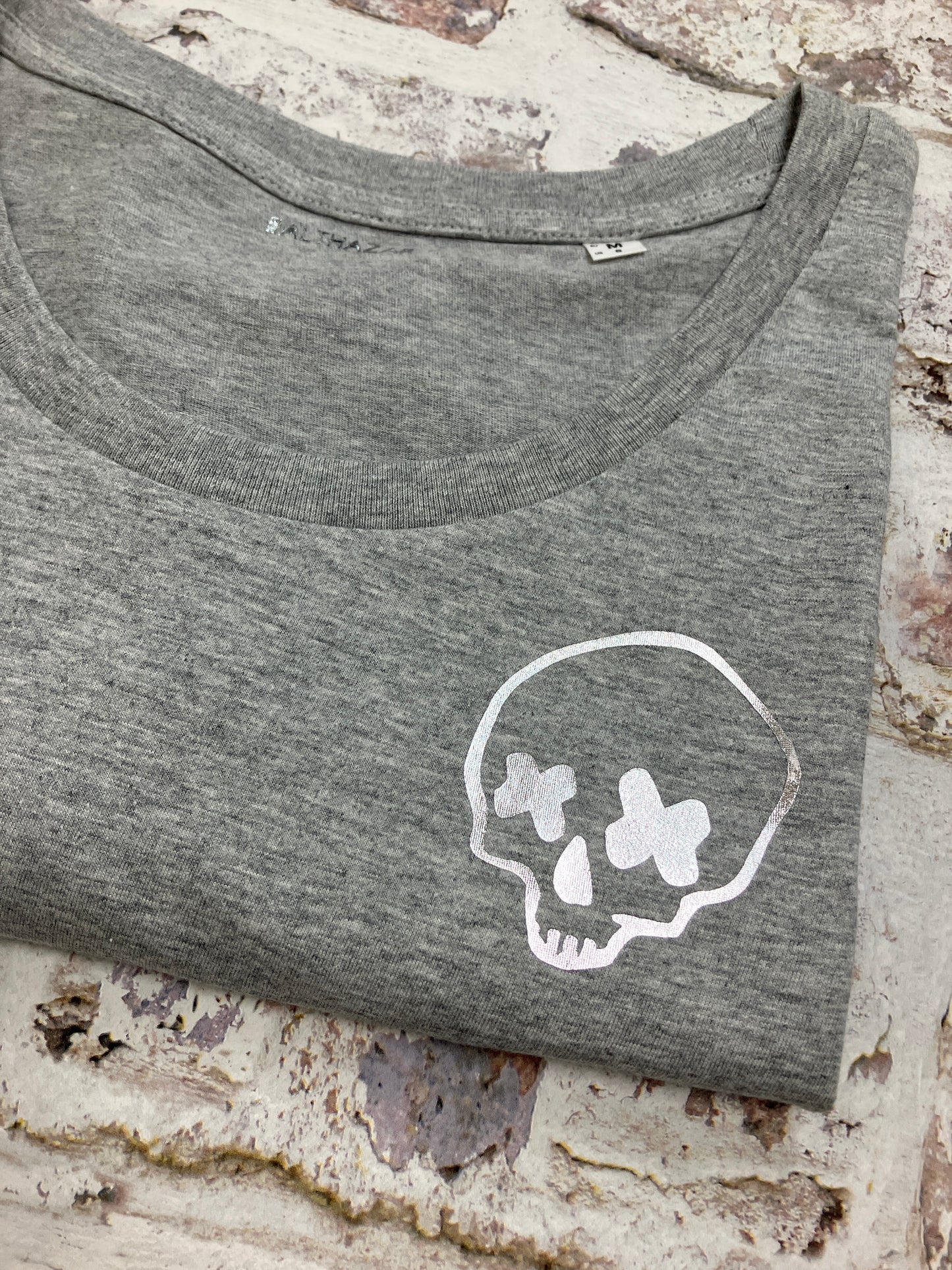 Miniature cross eyed skull t-shirt