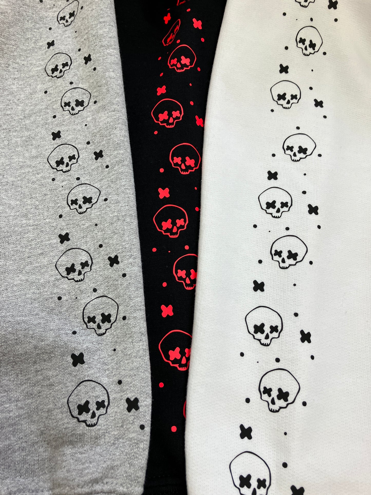 Cross eyed skull confetti sleeved sweatshirt