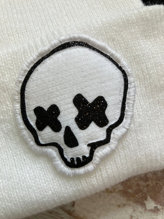 Miniature cross eyed skull beanie