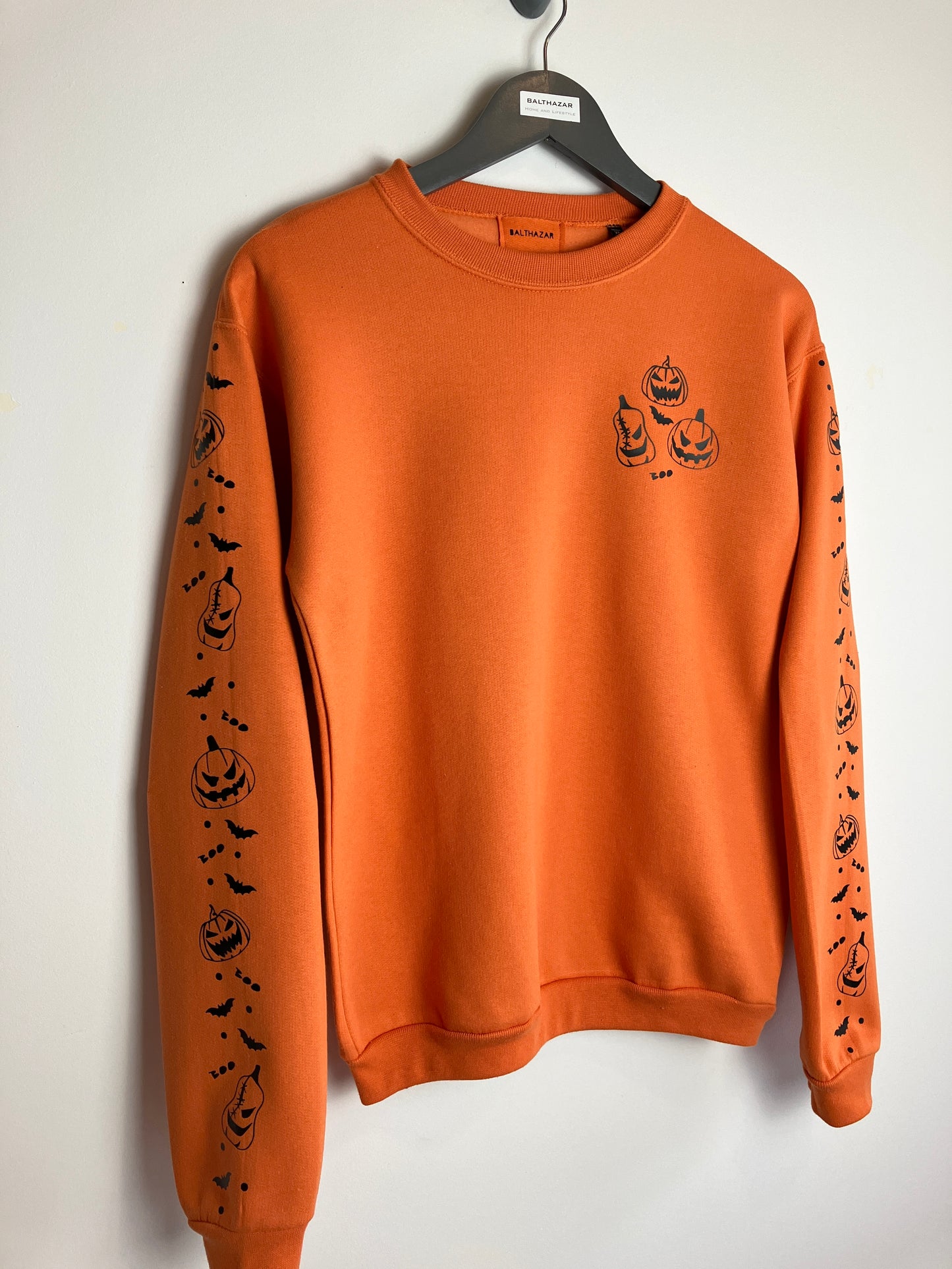 Pumpkin headed confetti sleeved sweatshirt